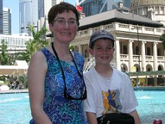 Hong Kong 01 04 Hong Kong Statue Square Charlotte and Pete pose in Statue Square just like all the Filipino housemaids, nannies, and waitresses, thousands of whom work in Hong Kong and send most of...